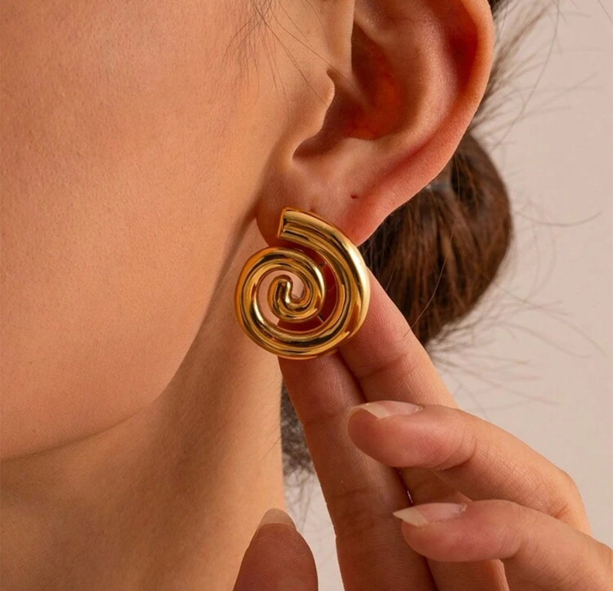 Caravanas espiral acero dorado