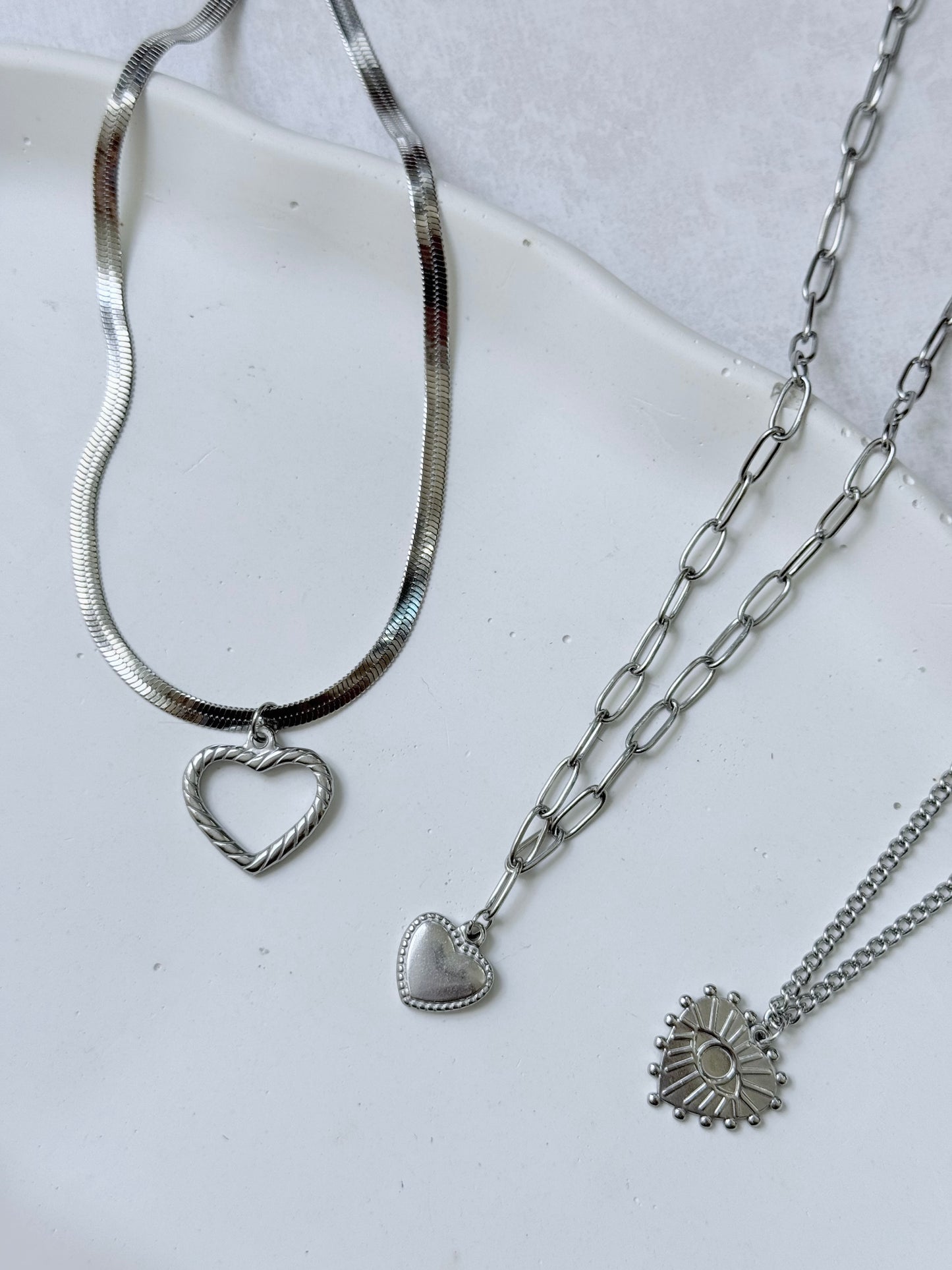 Collares corazón acero